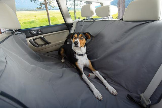 dog laying down in back seat of car, using Ruffwear dirtbag seat cover